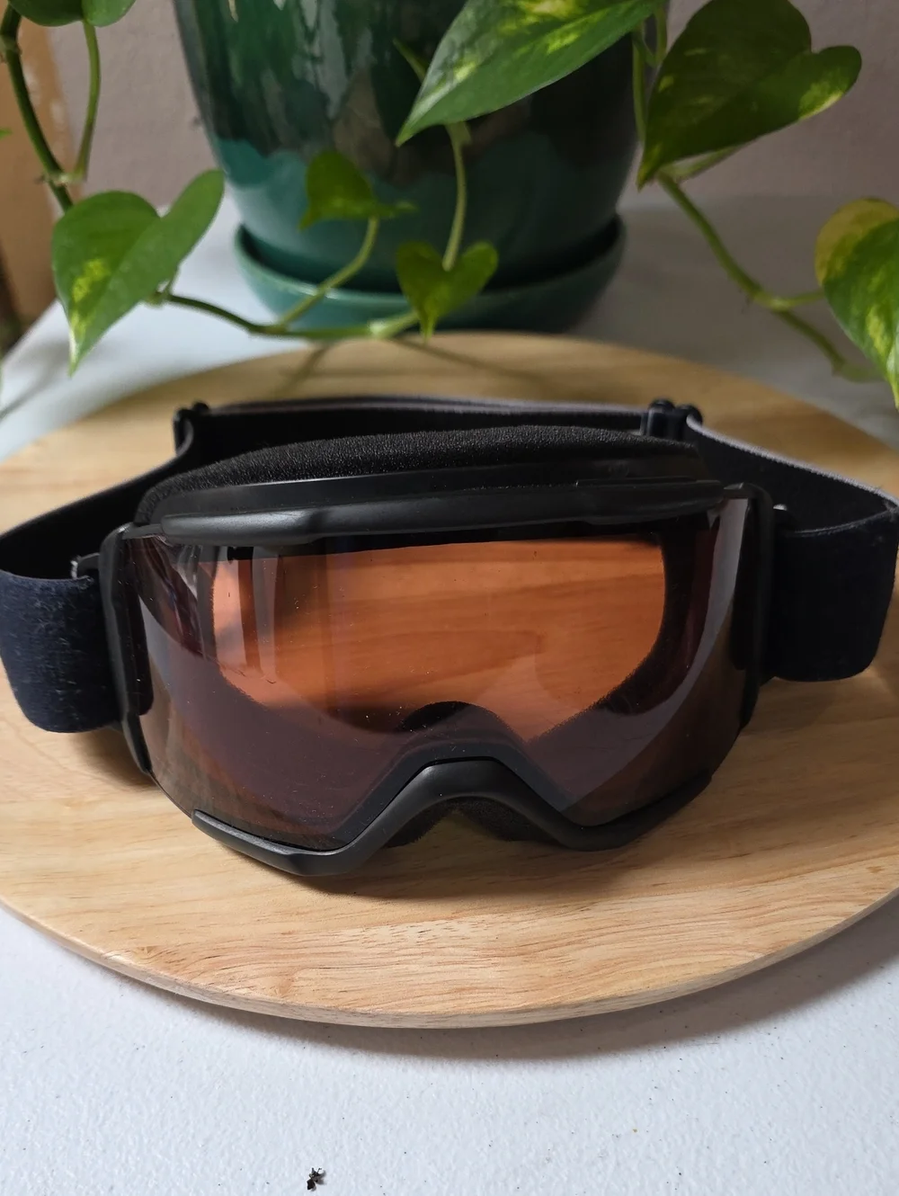 Smith Optics snow goggles featuring a black strap with white branding
